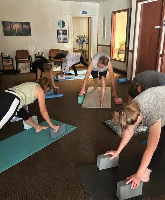 People doing yoga class at Reenew Wellness Center